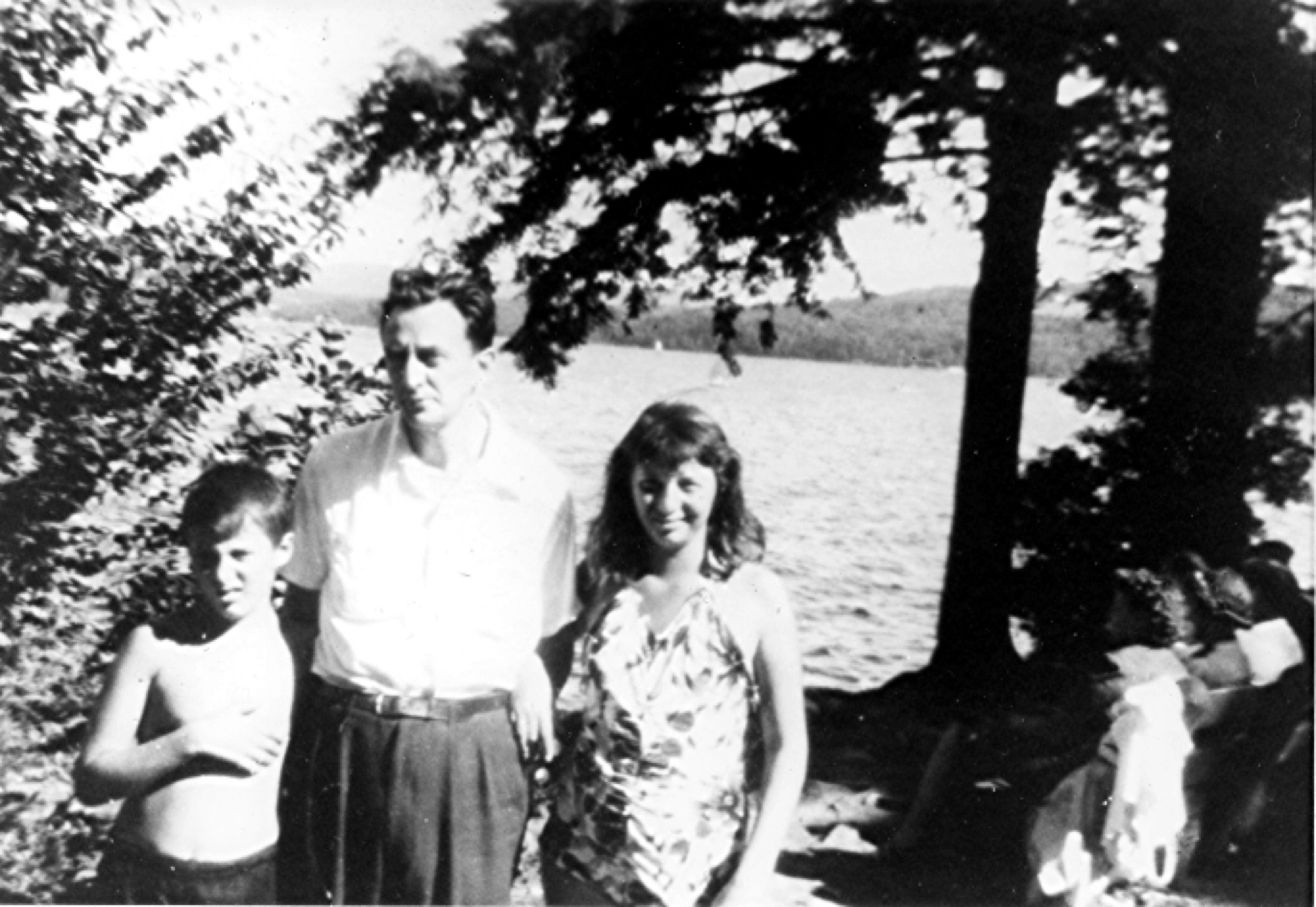 Marshall as a boy with family beside a lake