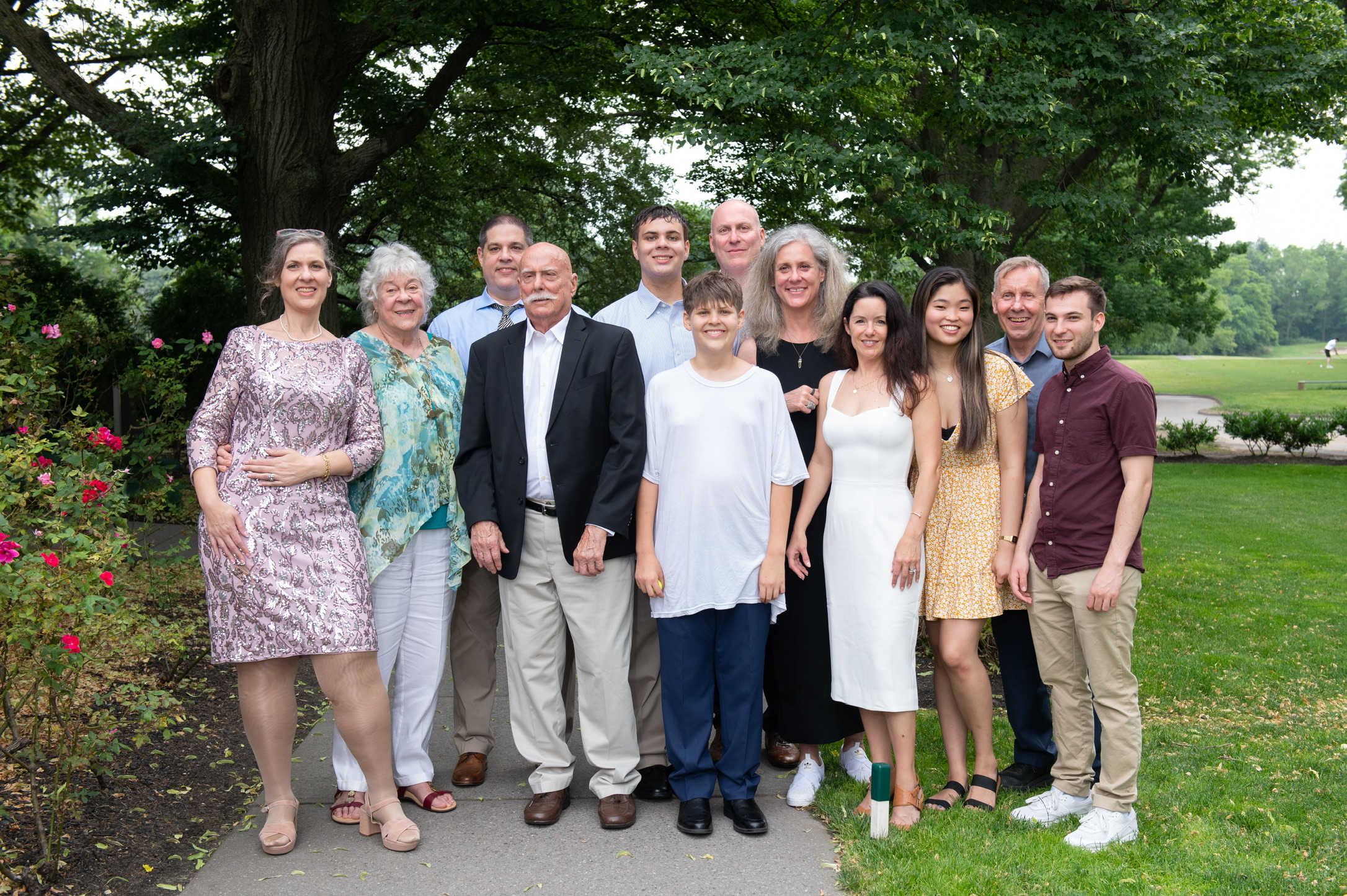 Marshall and Marian gathered outdoors with their extended family