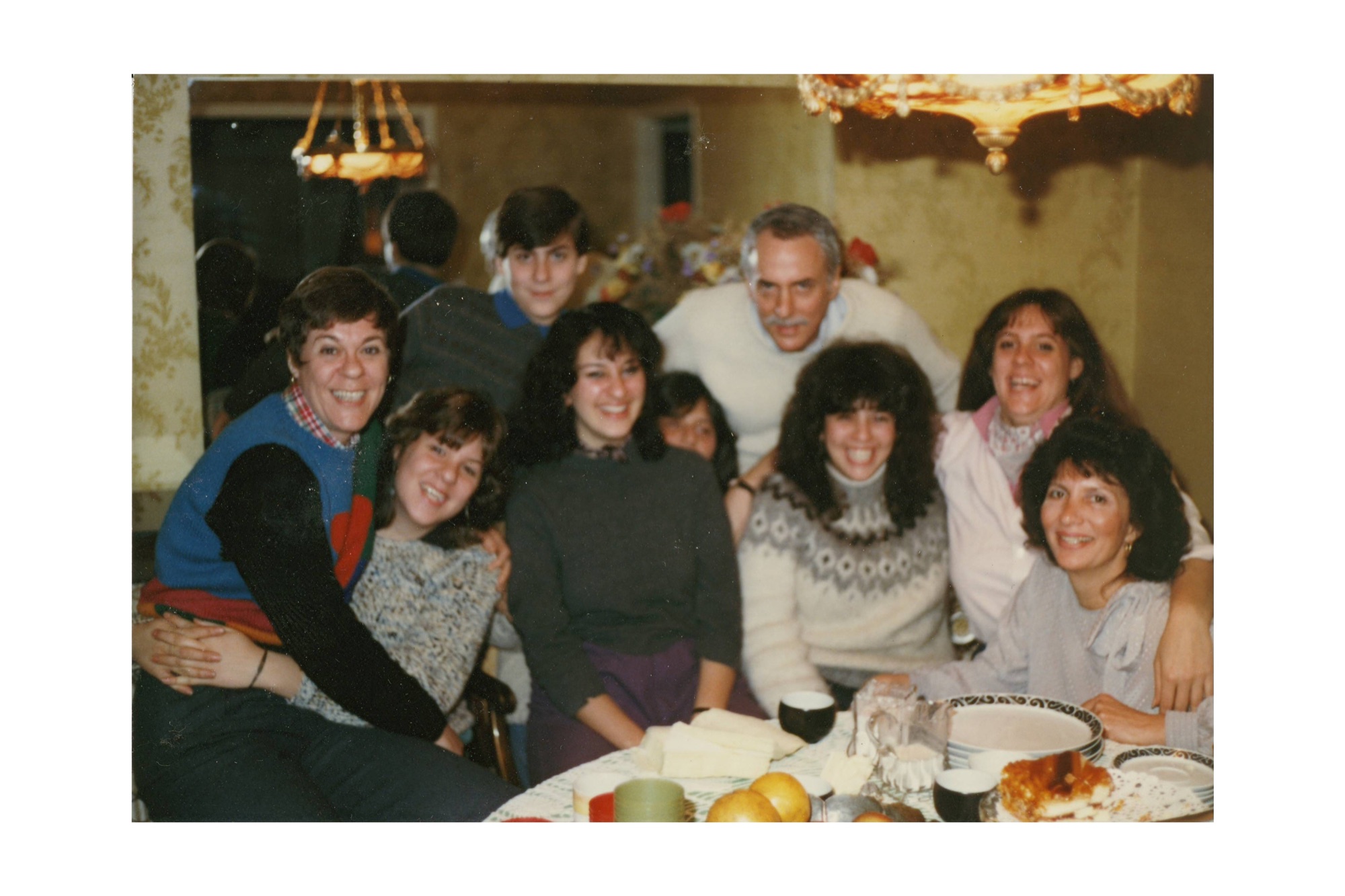 Marshall and Marian surrounded by family around the table