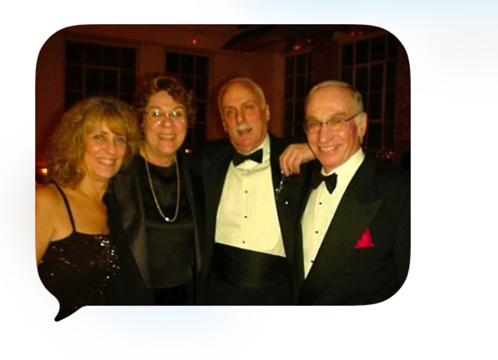 Marshall celebrating with friends at a black-tie gathering