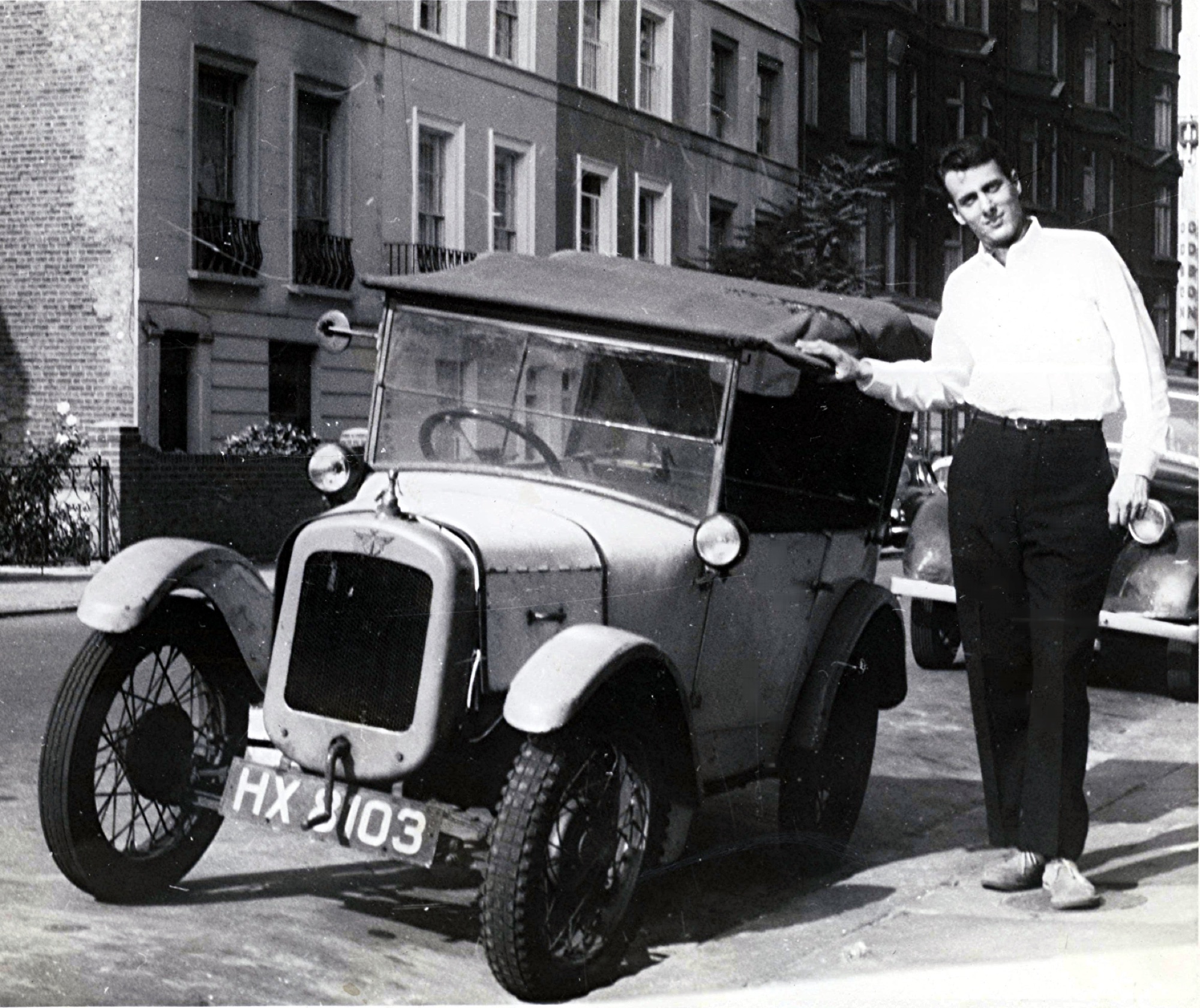 Marshall beside a vintage car in London in 1959