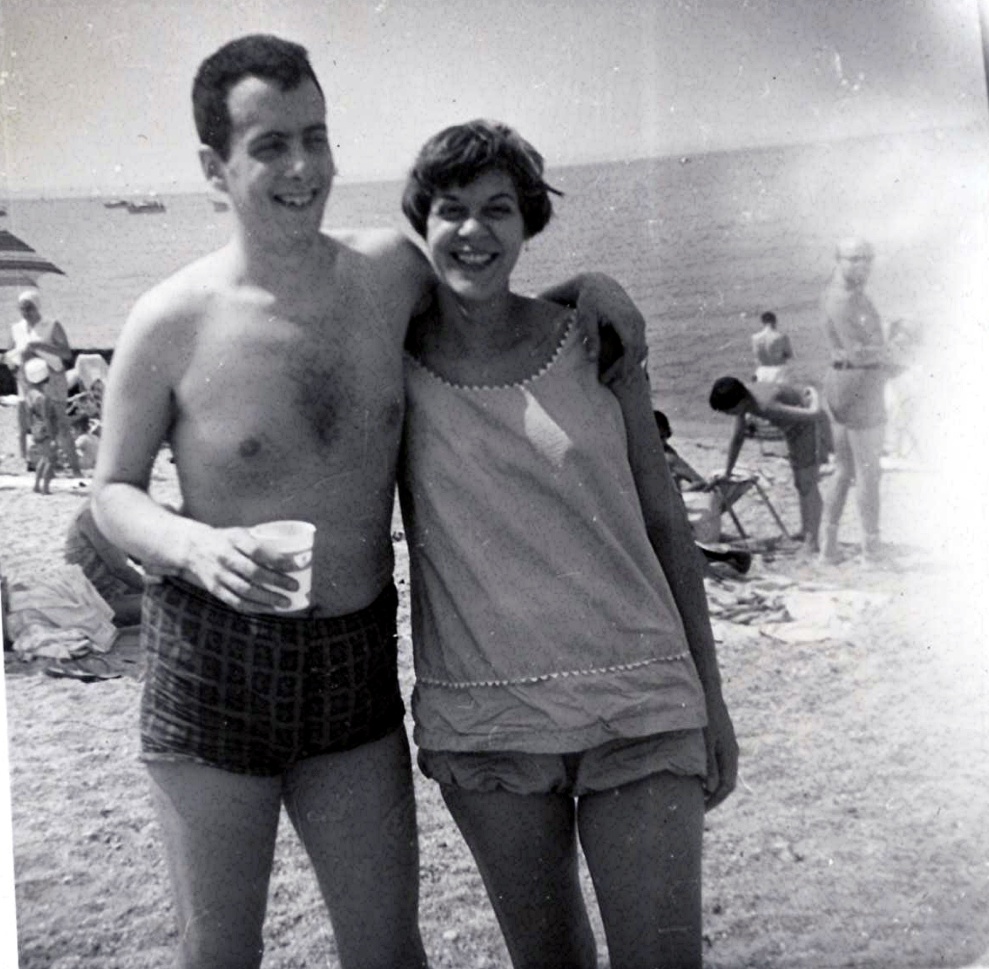 Marshall and Marian laughing together at the beach in 1962