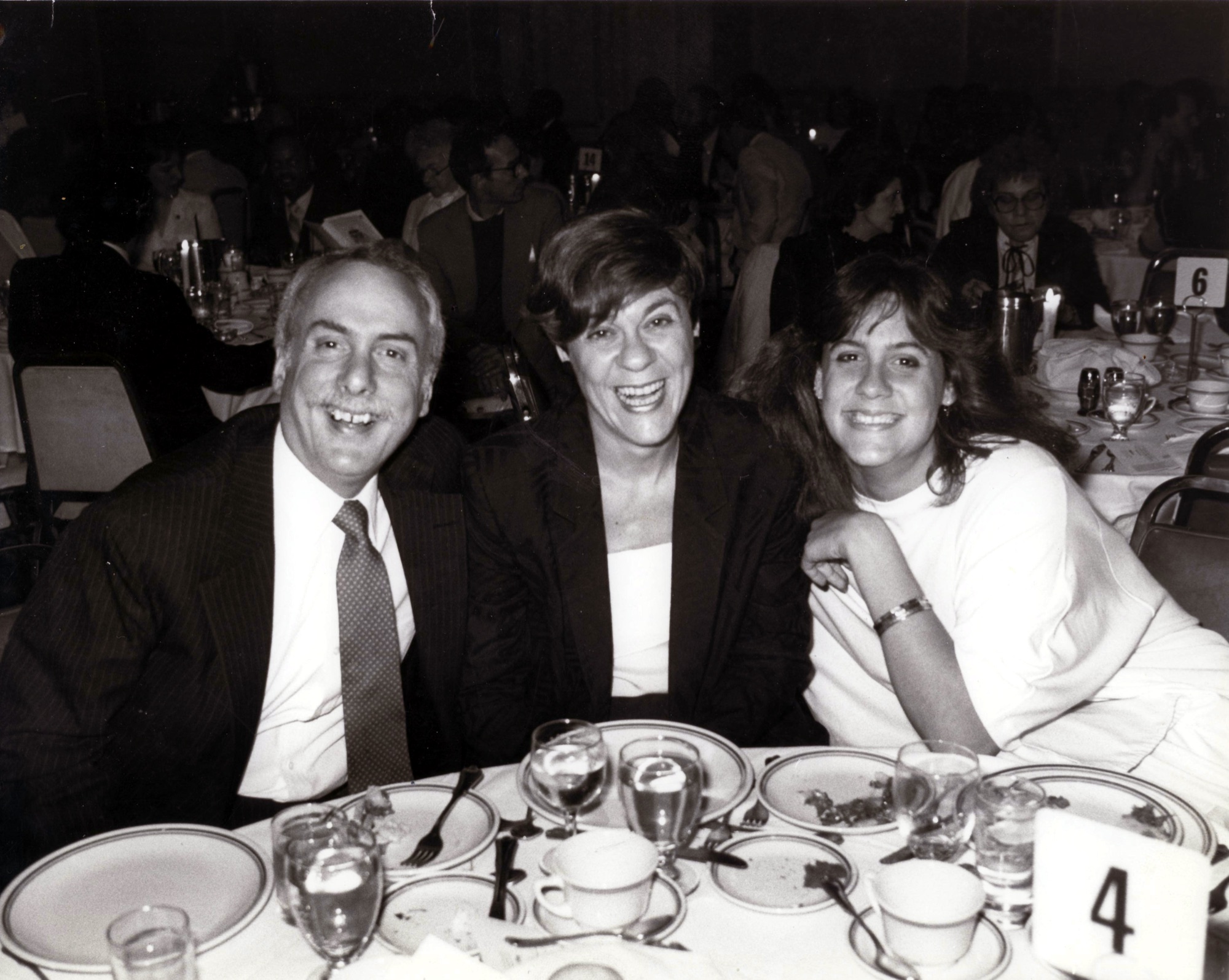 Marshall, Marian, and Becca sharing a joyful dinner in 1984