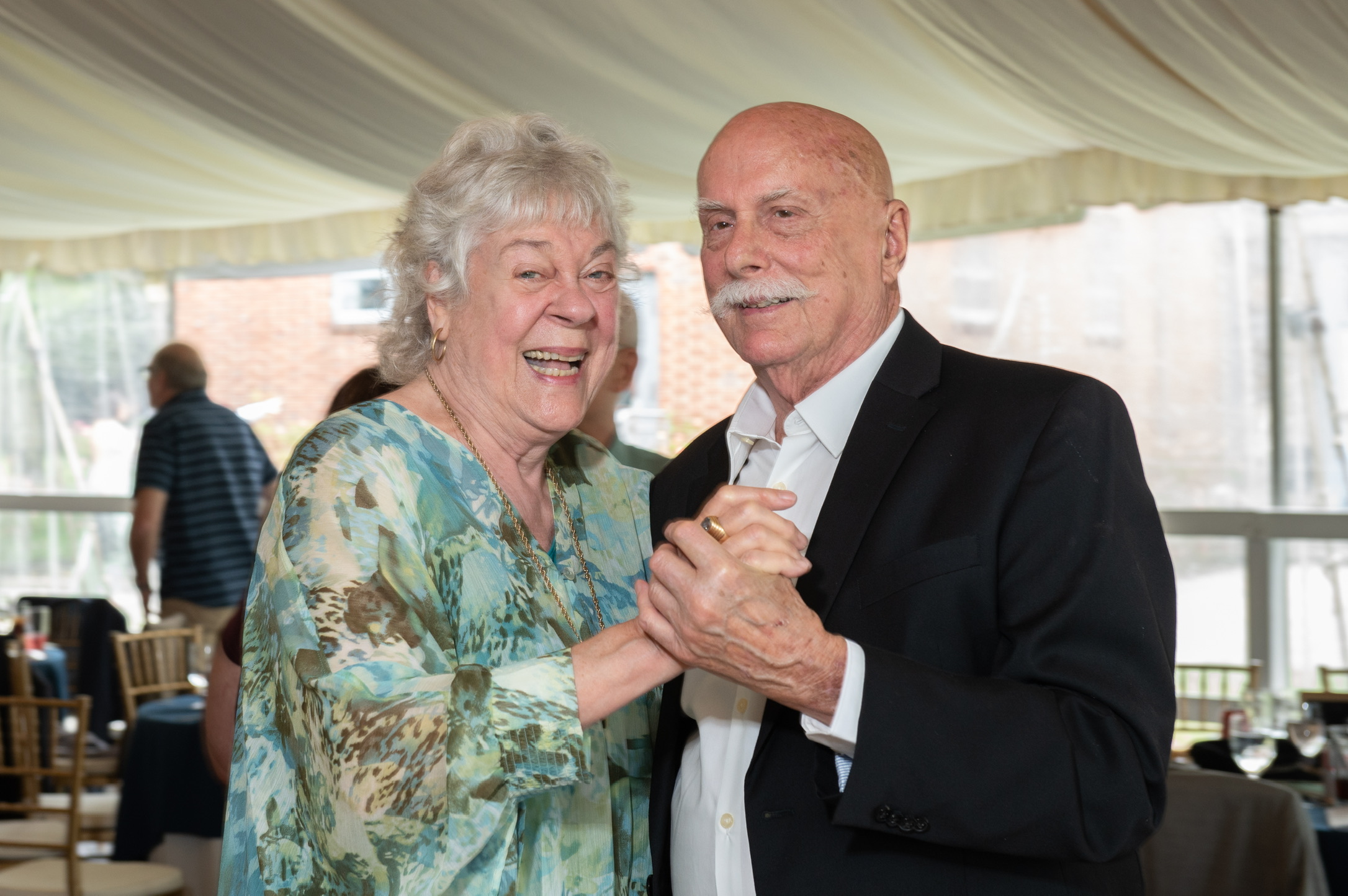 Marshall and Marian dancing together at a family celebration
