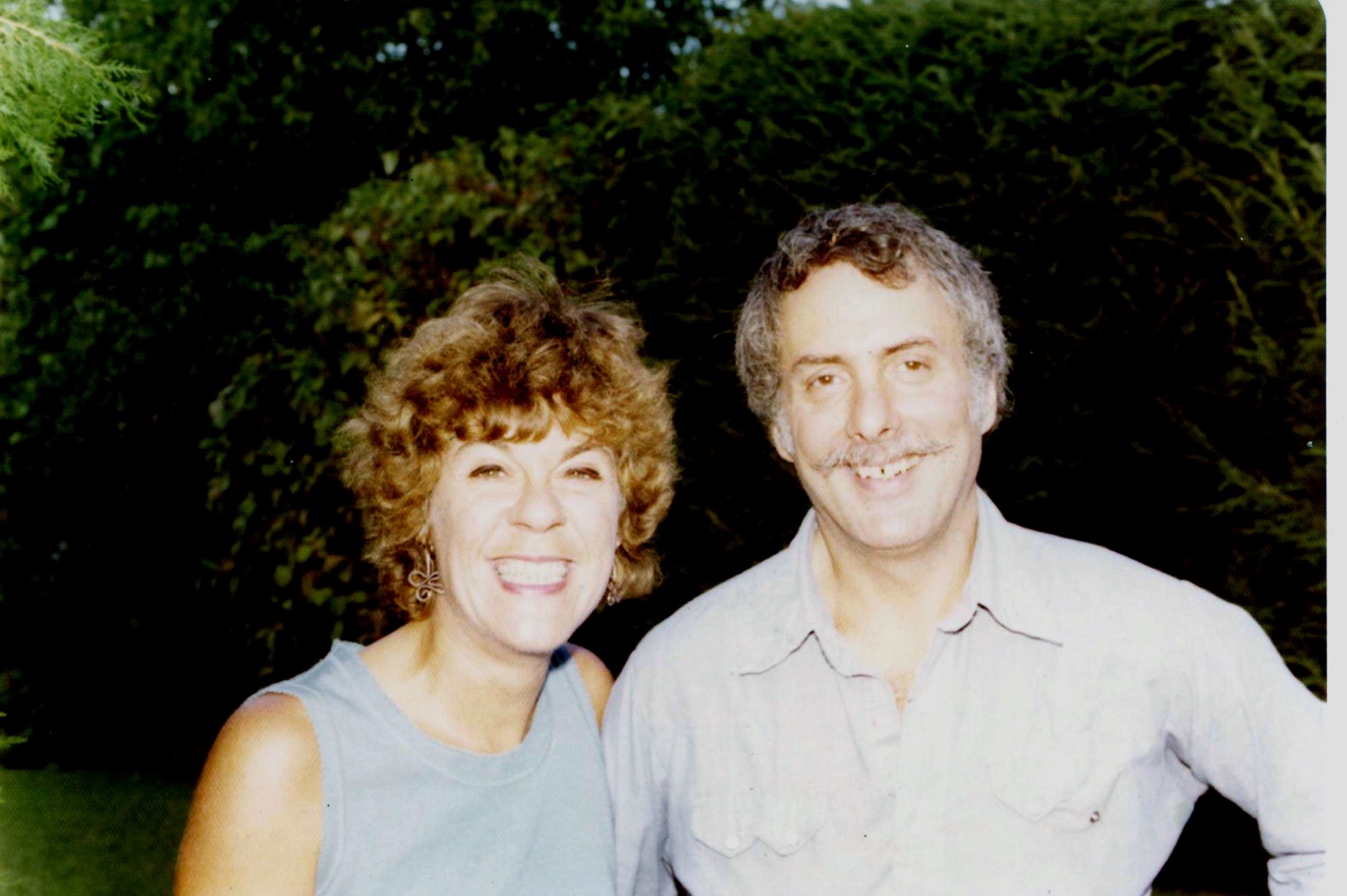 Marshall and Marian smiling together outdoors