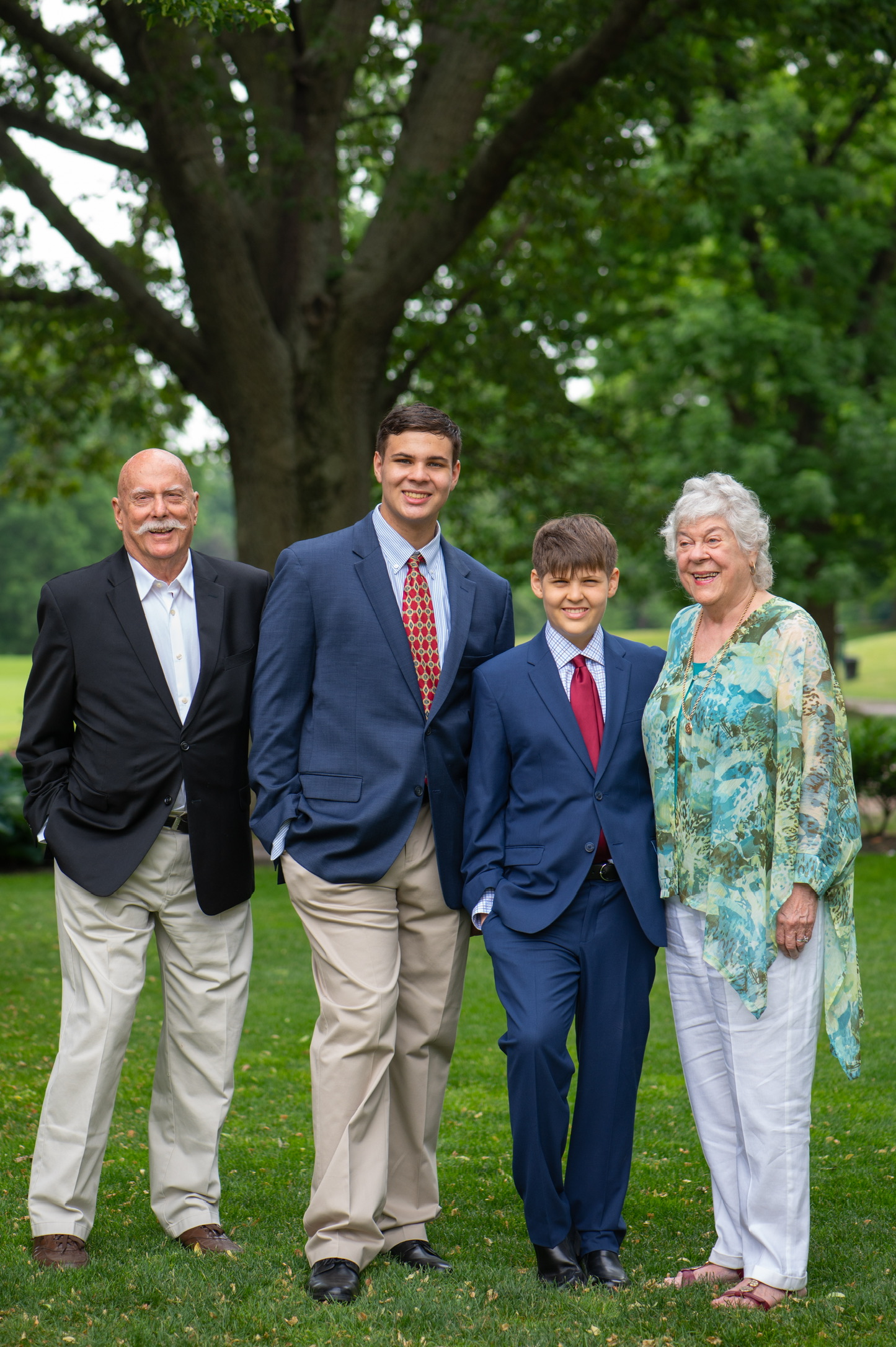 Marshall and Marian dressed for a celebration with two grandsons