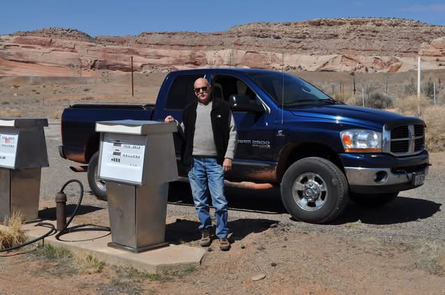 Marshall on a road trip beside his blue pickup truck